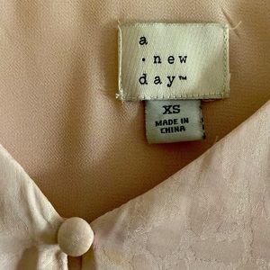 Light pink silky tank top from Urban Outfitters